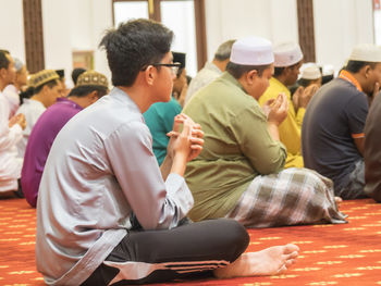 Group of people sitting in temple