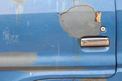 Close-up of old car door handle