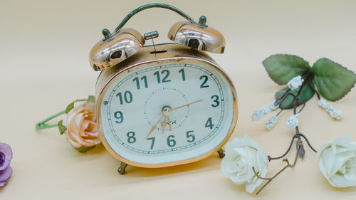 Close-up of clock on table