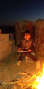 Portrait of boy sitting at home