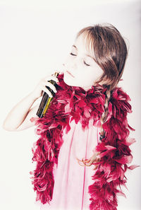 Woman looking away against white background