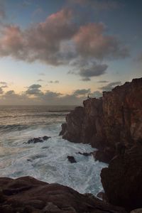 Scenic view of sea against cloudy sky