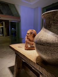 Portrait of young woman sitting at home