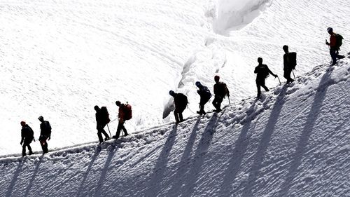 People on snow covered field