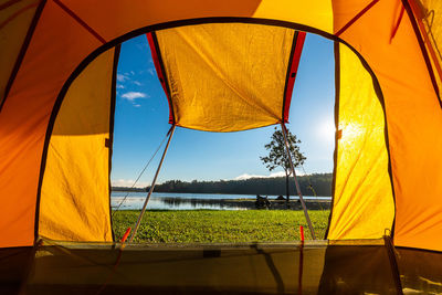 Scenic view of yellow tent against sky
