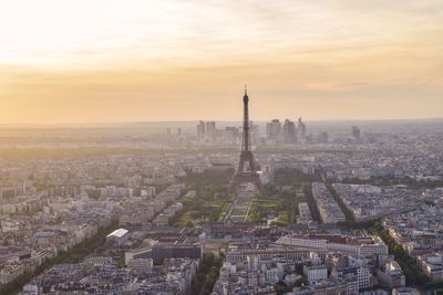 Cityscape against cloudy sky