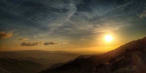 Scenic view of mountains against sky during sunset