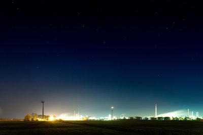 Scenic view of field against sky at night