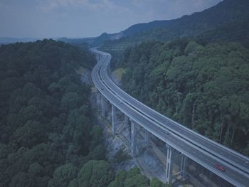 High angle view of road amidst mountains against sky