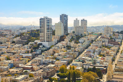 Aerial view of cityscape against sky