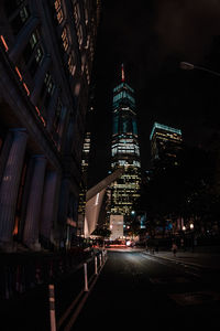 Low angle view of illuminated buildings at night