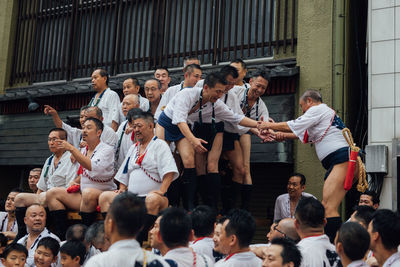 Group of people standing in front of building