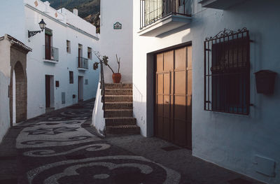 Alley amidst buildings in city