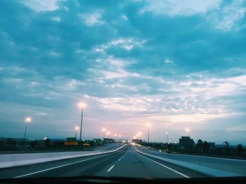 Highway in city against sky