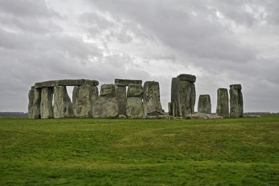 Ruins of old ruins against cloudy sky