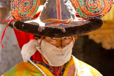 Close-up of person wearing hat