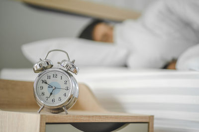 Close-up of man sleeping on bed at home