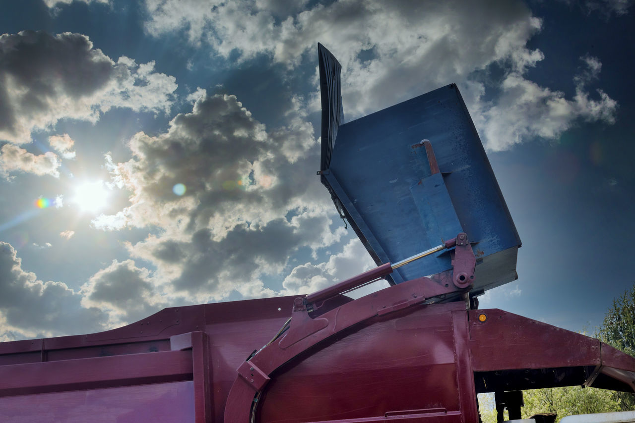 LOW ANGLE VIEW OF TELEPHONE BOOTH AGAINST SKY