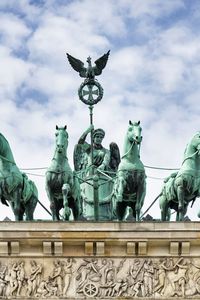 Low angle view of statue against sky