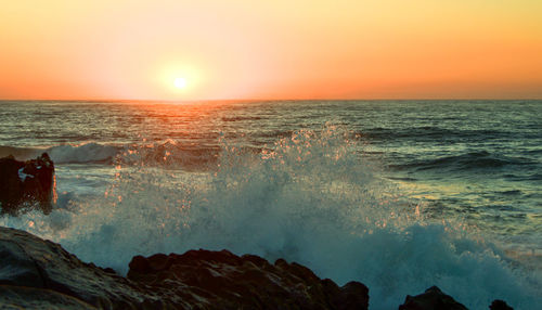 Scenic view of sea against sky during sunset