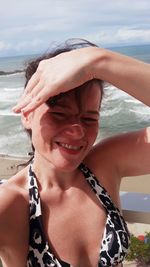 Portrait of smiling woman on beach