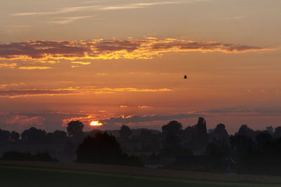 Scenic view of sunset over landscape