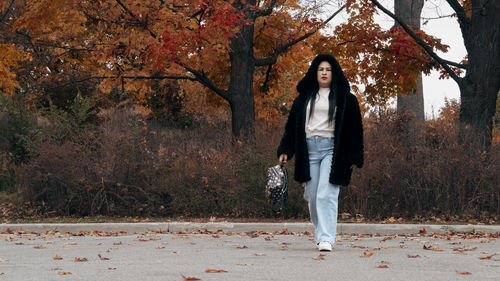 Full length of woman standing on field