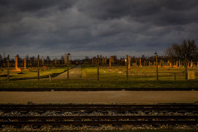 View of railroad tracks against cloudy sky