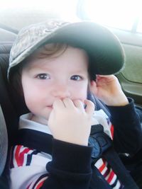 Portrait of cute boy in car