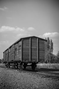 Train on railroad track against sky