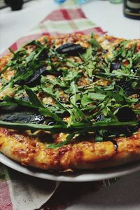 Close-up of pizza served on table