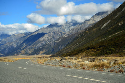 Straight road leading towards a snow capped mountain in new zealand south