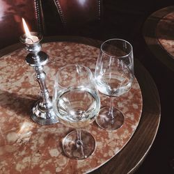 Close-up of illuminated glasses on table