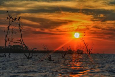 Scenic view of sea against sky during sunset