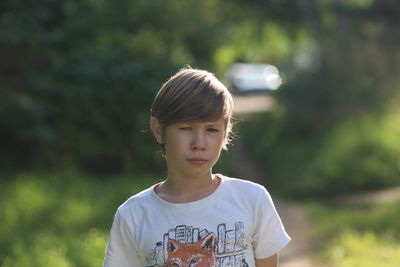Portrait of a boy standing outdoors