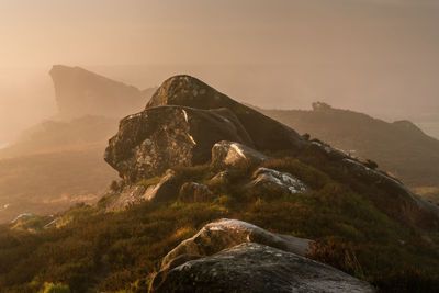 Rock formation on land against sky