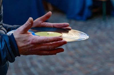 Close-up of man holding record