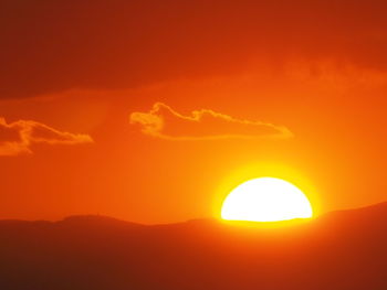 Scenic view of orange sky