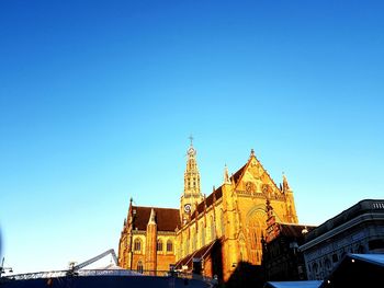 Low angle view of temple against blue sky