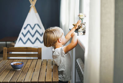 Boy playing with umbrella