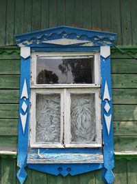 Close-up of blue window on old building