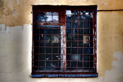 Close-up of abandoned house window