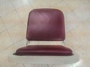 High angle view of seats on tiled floor at home
