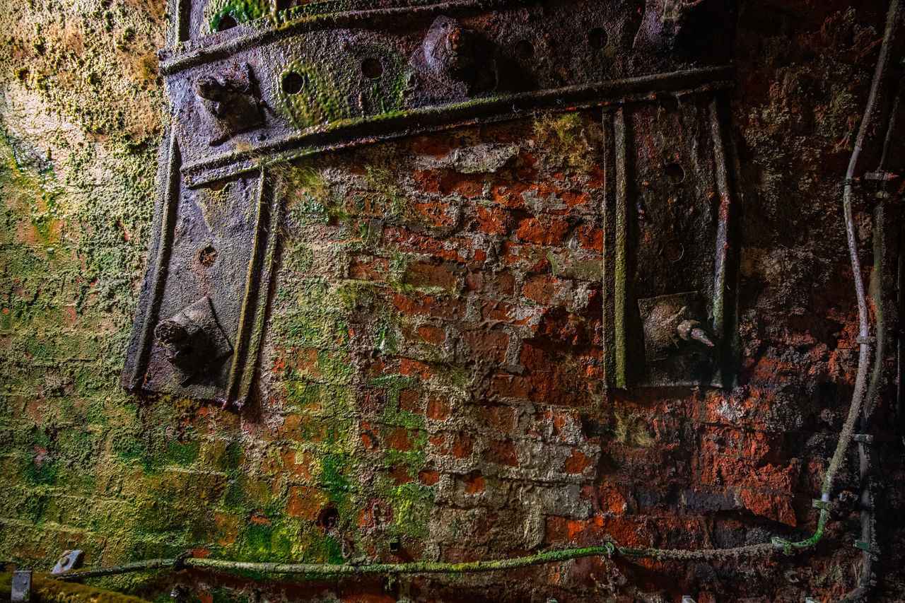 OLD RUSTY WALL WITH METAL