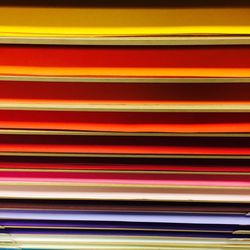 Full frame shot of colorful papers in shelf