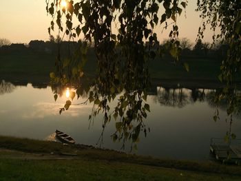 Scenic view of lake against sky during sunset