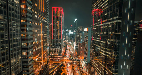 Panoramic view of illuminated buildings in city at night