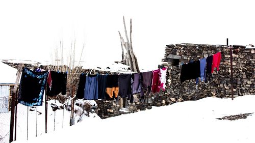 Clothes drying on clothesline against sky