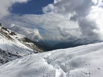 Scenic view of snowcapped mountains against sky