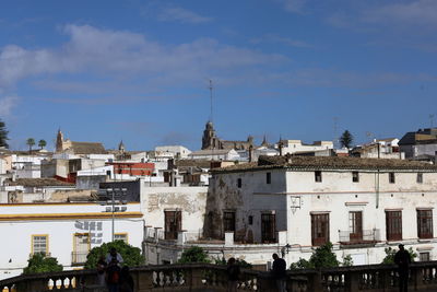 Buildings in city against sky